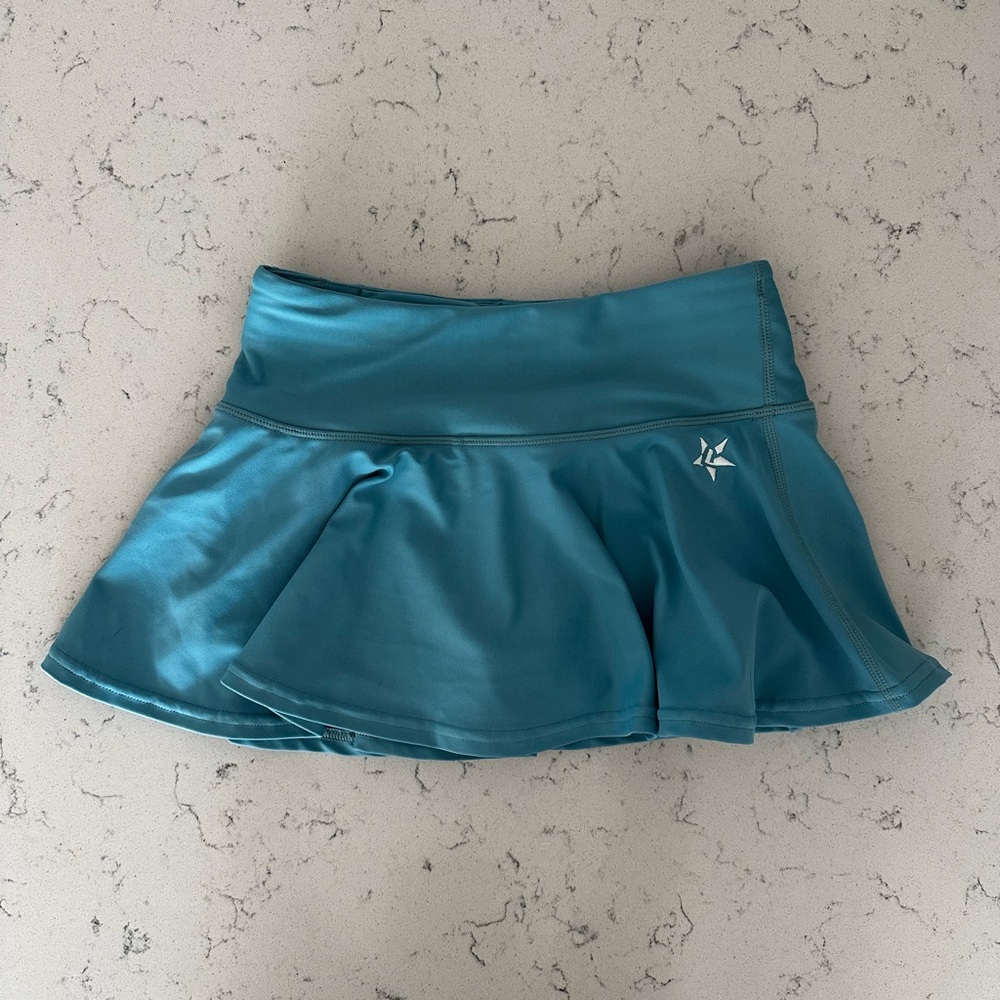 Rebel Athletic teal girls skirt with built in spandex shorts underneath